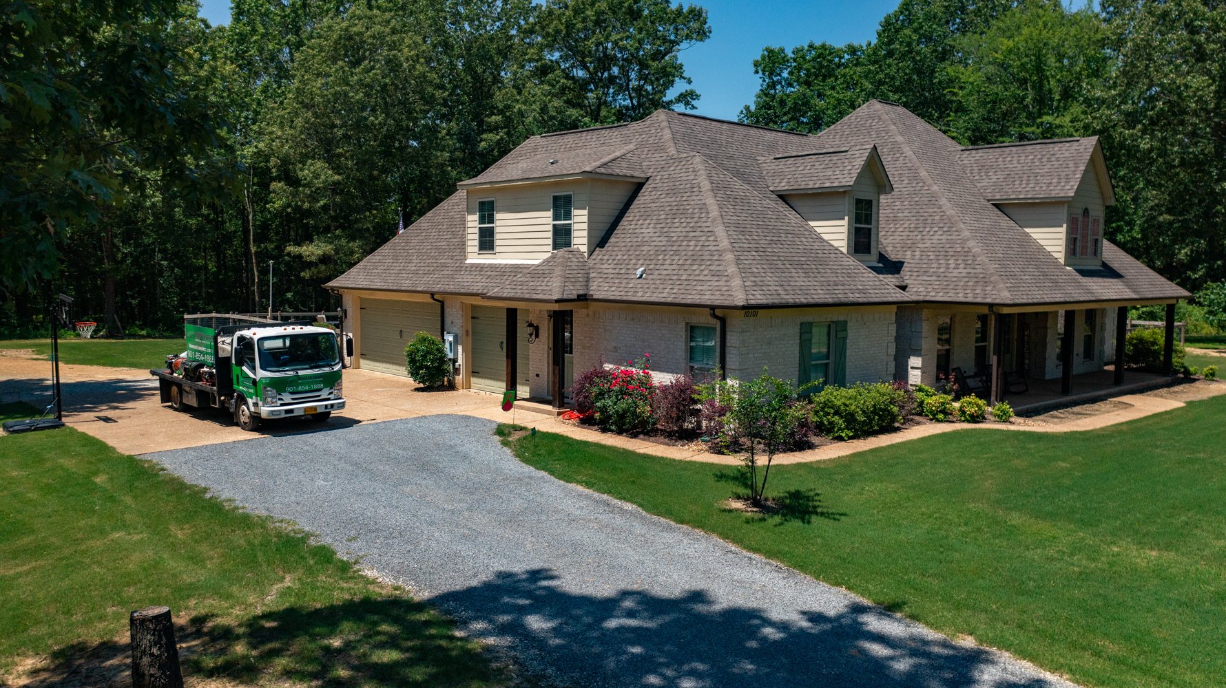 master lawn truck parked in home driveway