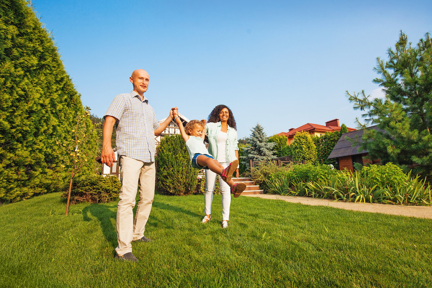 family enjoying a well-cared-for lawn