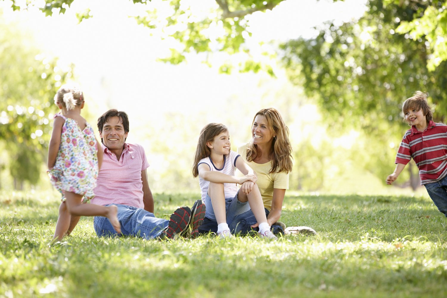 happy lawn care customers in their yard