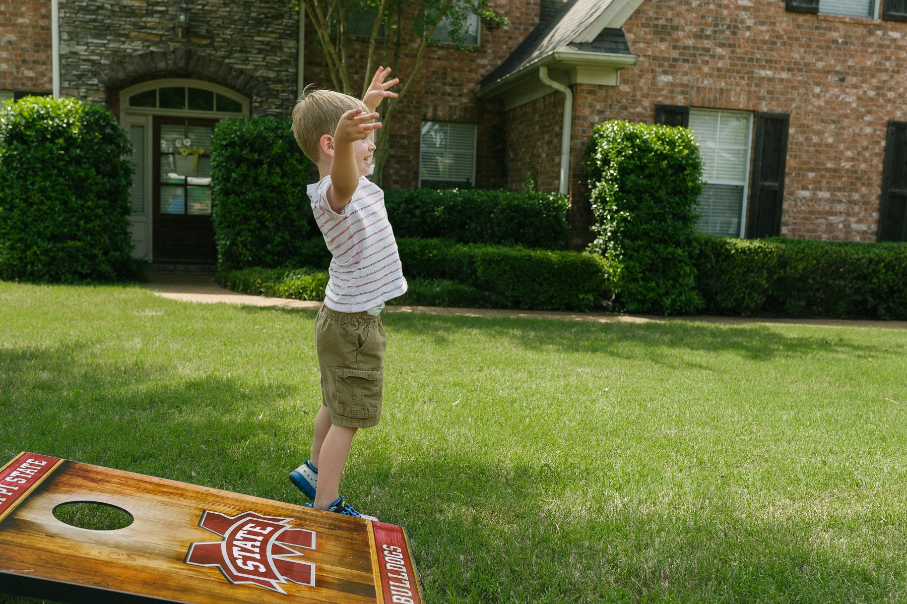 Child playing in lawn without mosquitoes