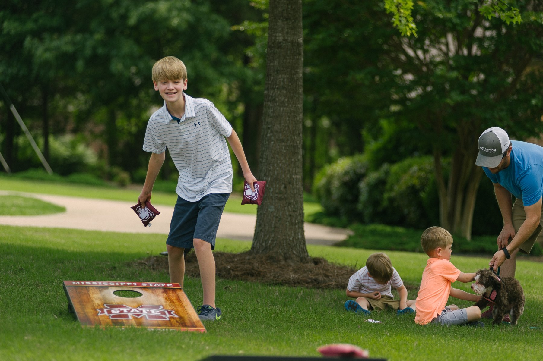 family in lawn with professional fire ant killer