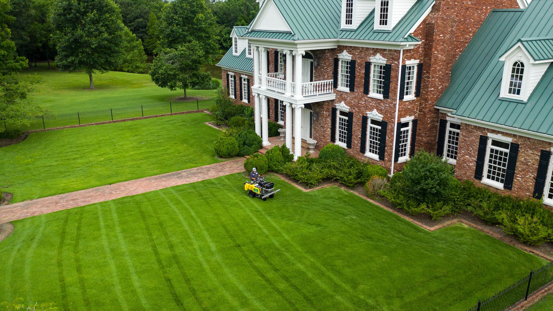 Lawn technician performing maintenance