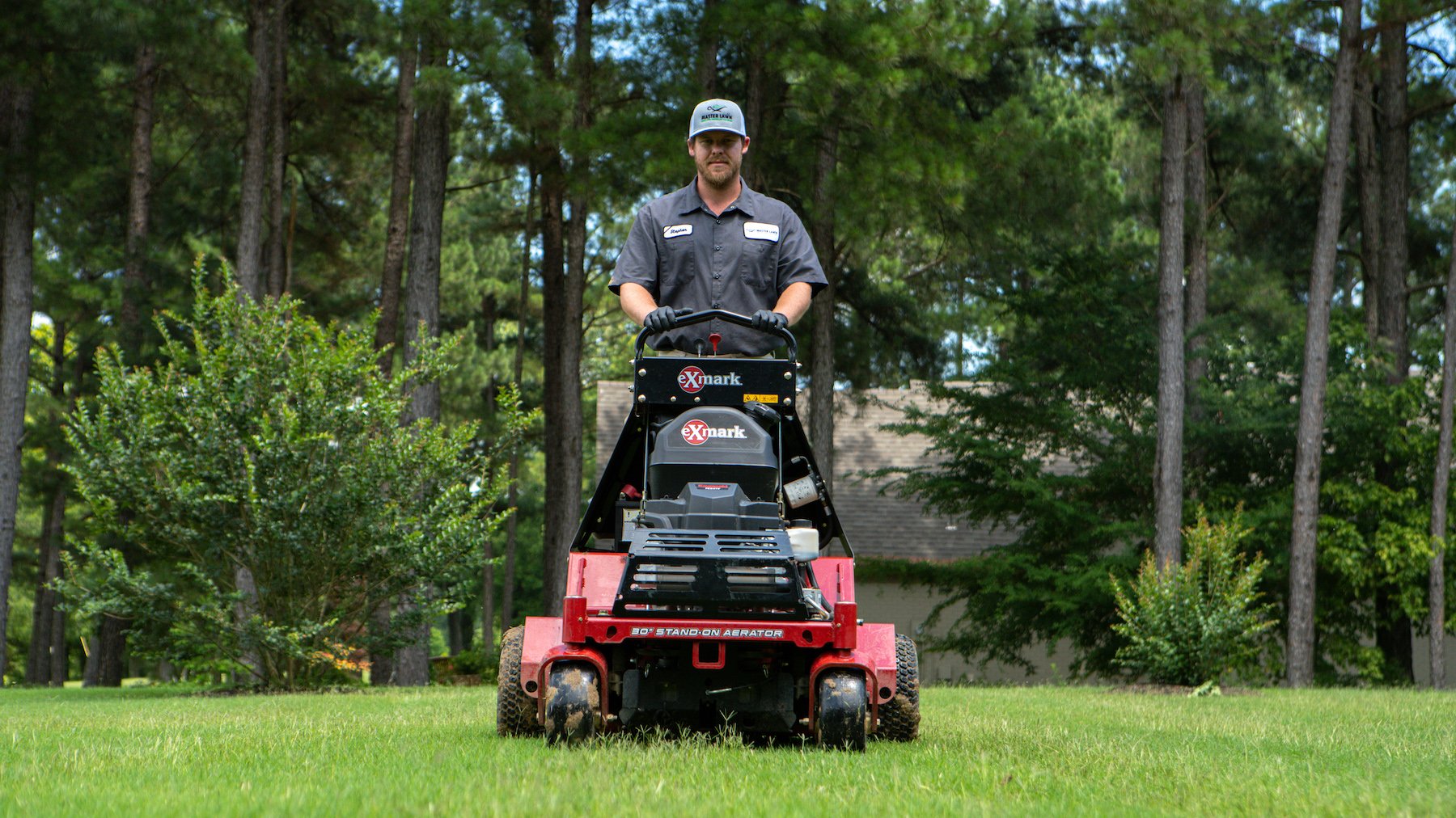 Professional technician aerating soil