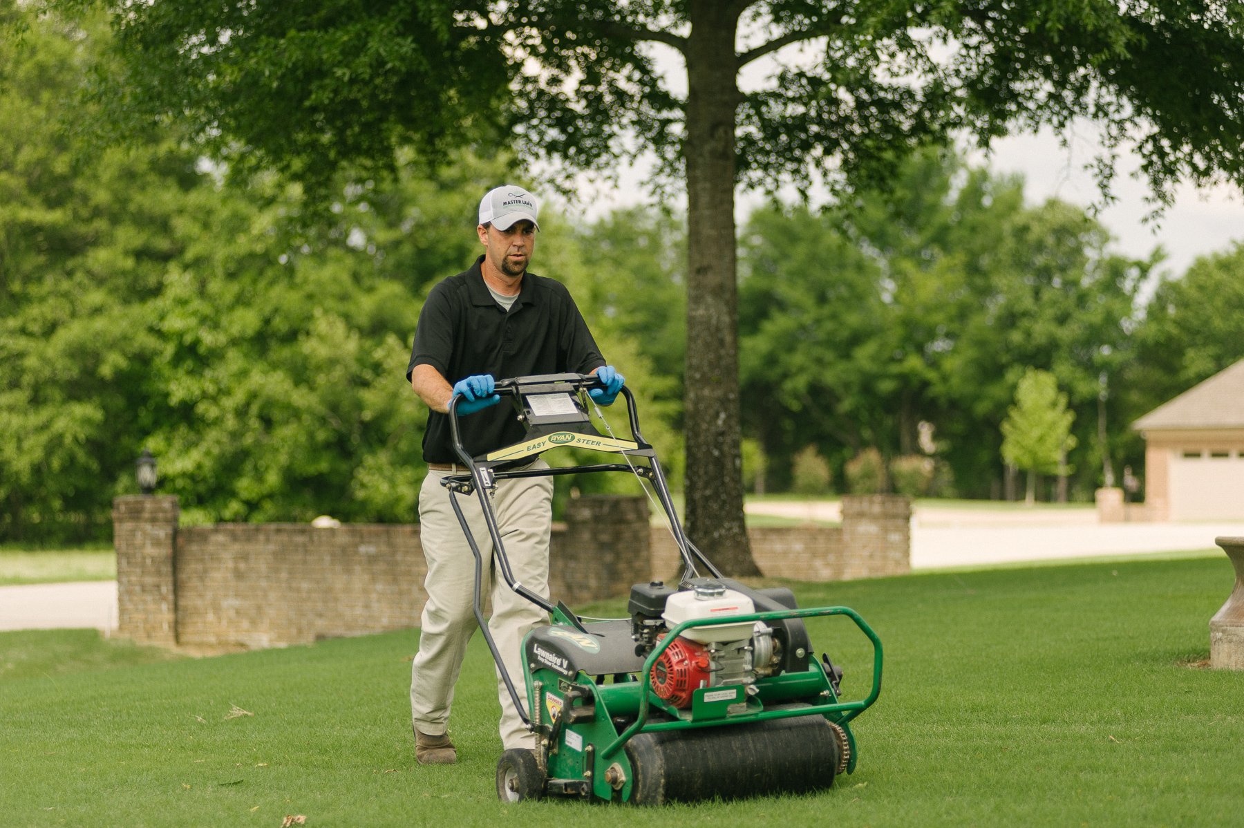 Master Lawn lawn technician aerating lawn