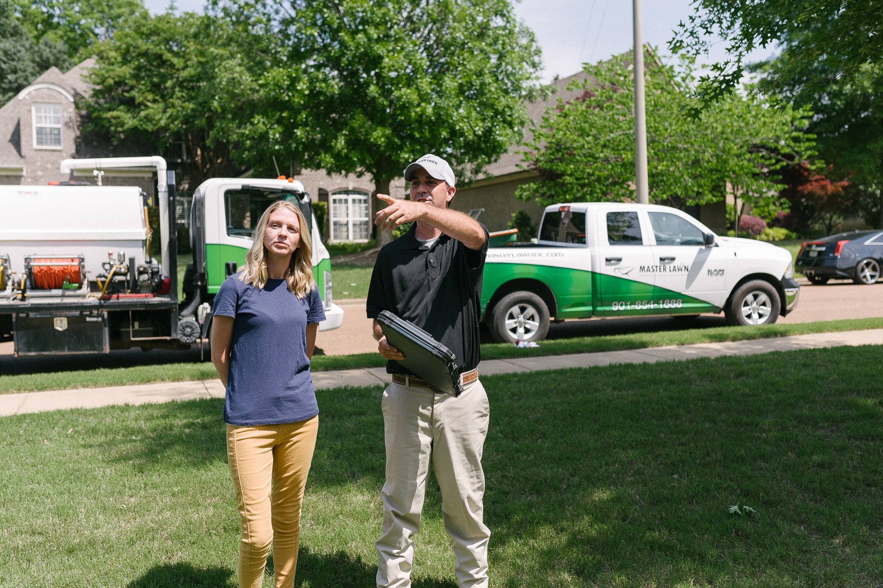 Master Lawn technician helping customer