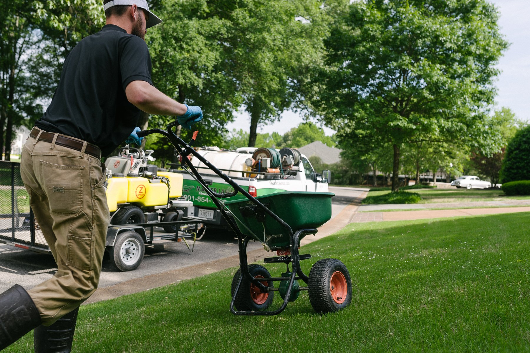 Master Lawn technician applying granular fungicide