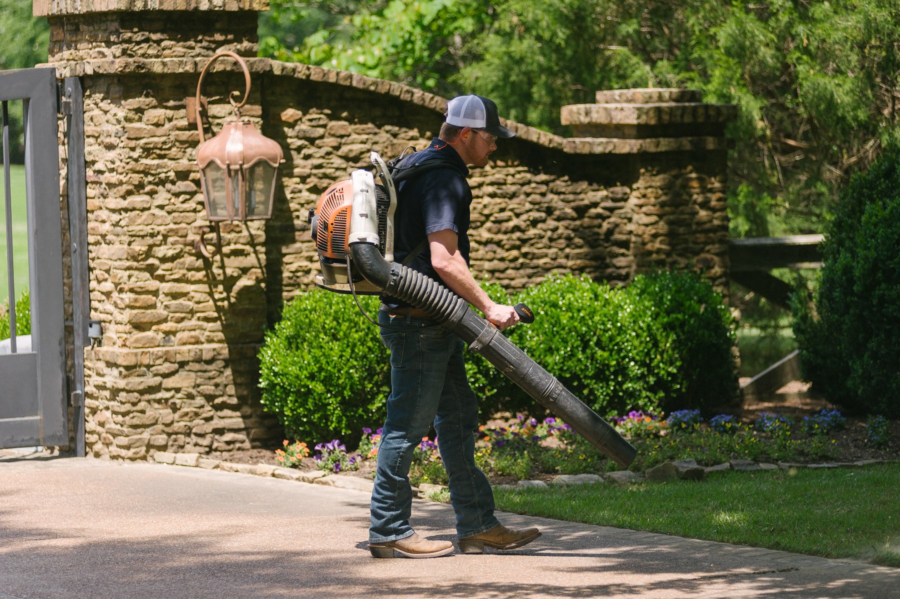 Pest control technician applying mosquito control