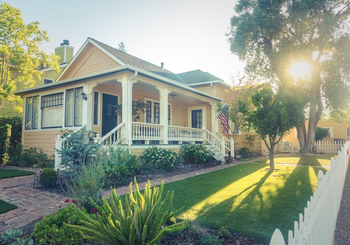 House with healthy trees and shrubs