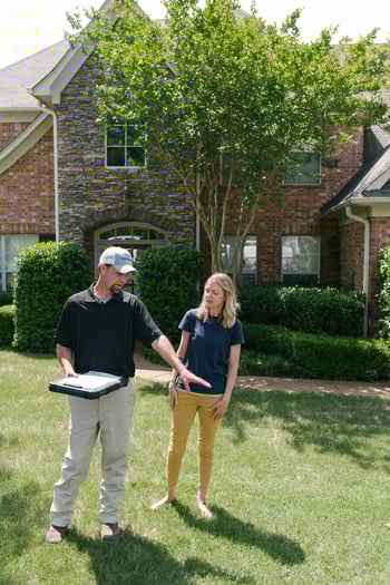lawn care technician providing advice